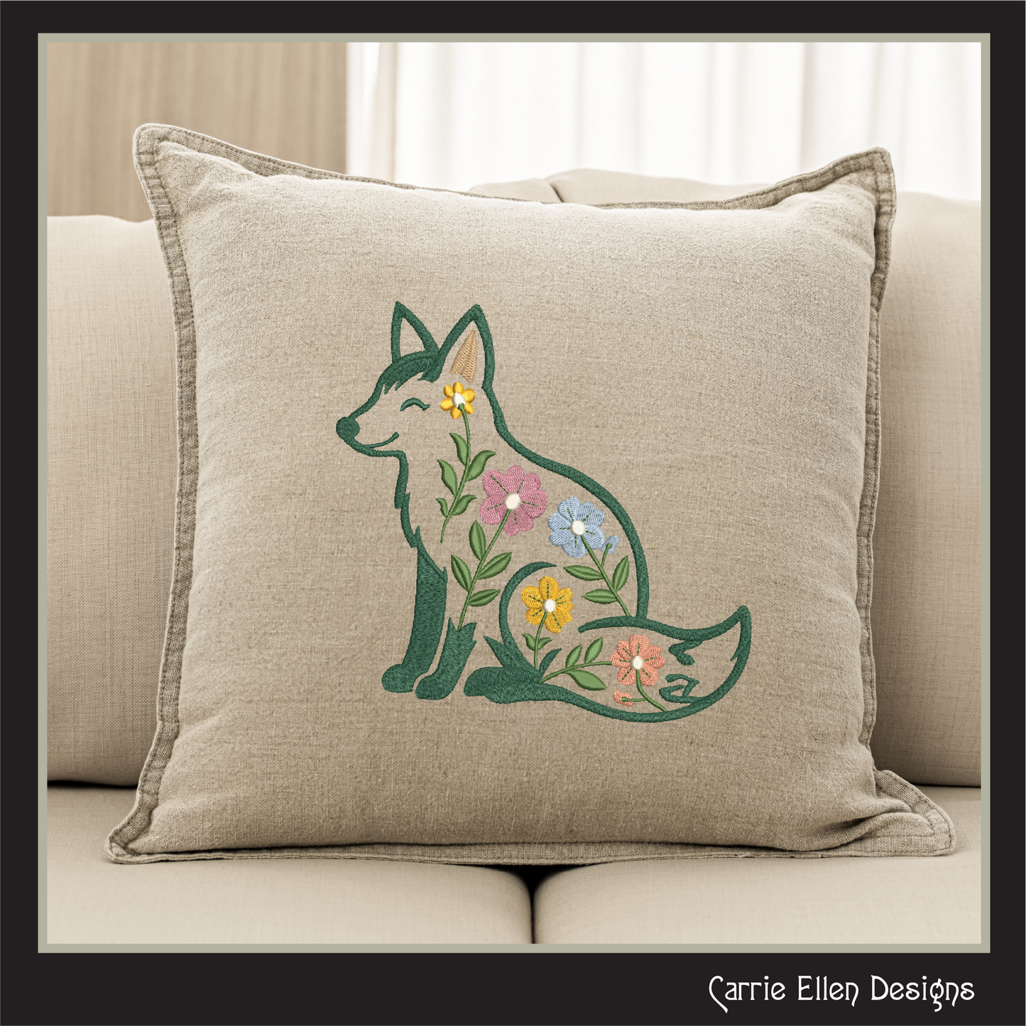 Decorative pillow with embroidered fox and flowers on a beige couch.