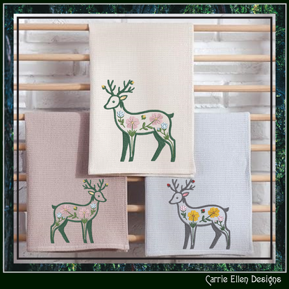 Kitchen towels featuring an elegant deer silhouette accented with delicate flowers and botanical details.
