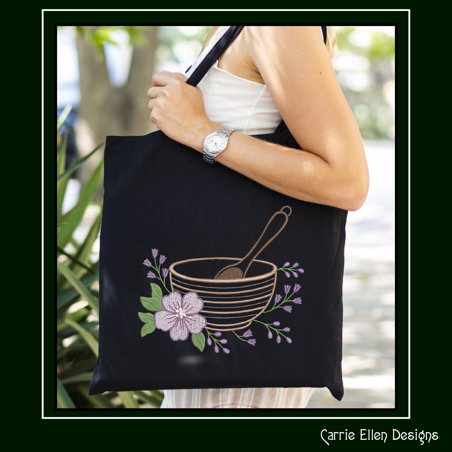 Black tote bag embroidery design of a  classic mixing bowl paired with a whisk and delicate floral accents
