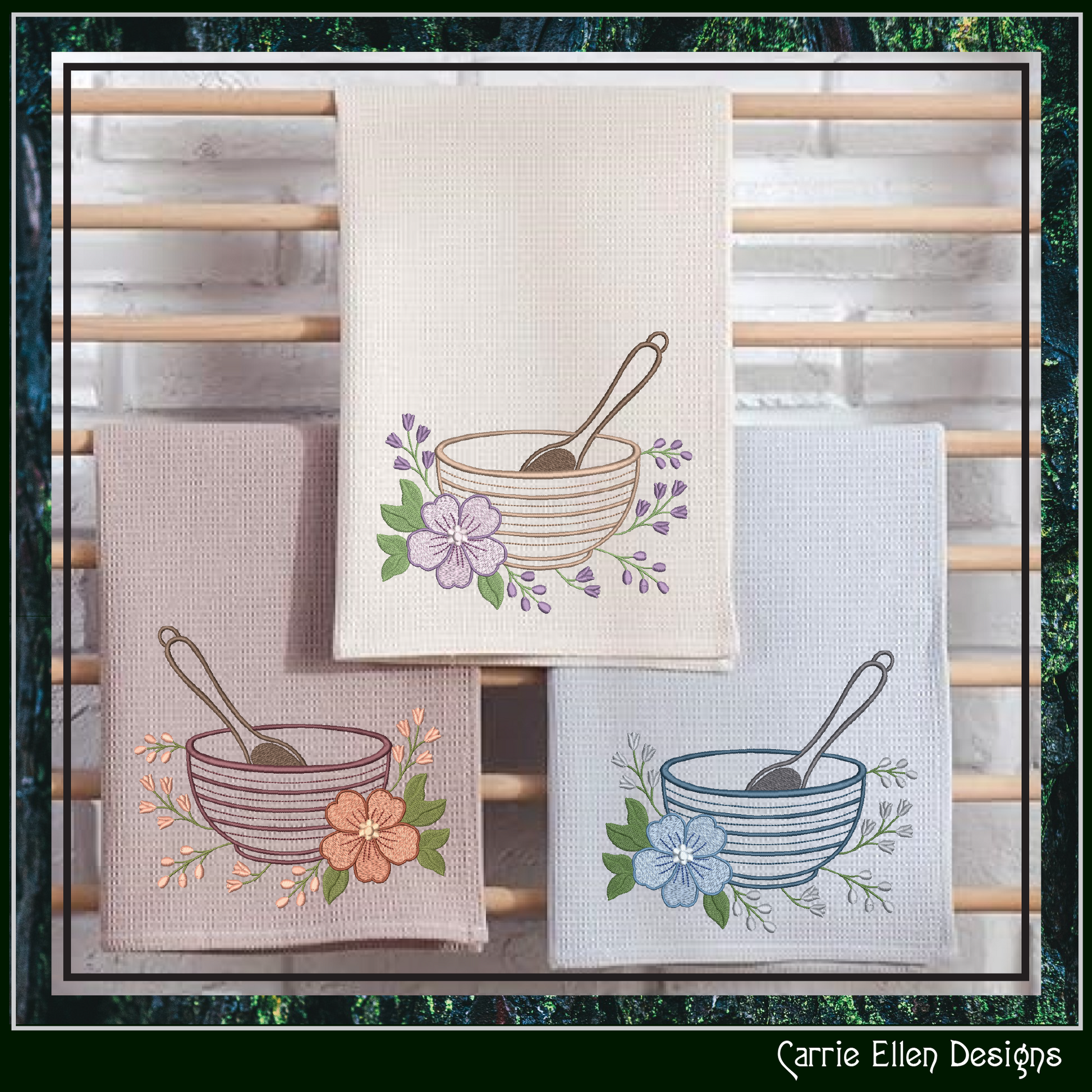 Set of three embroidered towels with floral and bowl designs on a wooden rack.