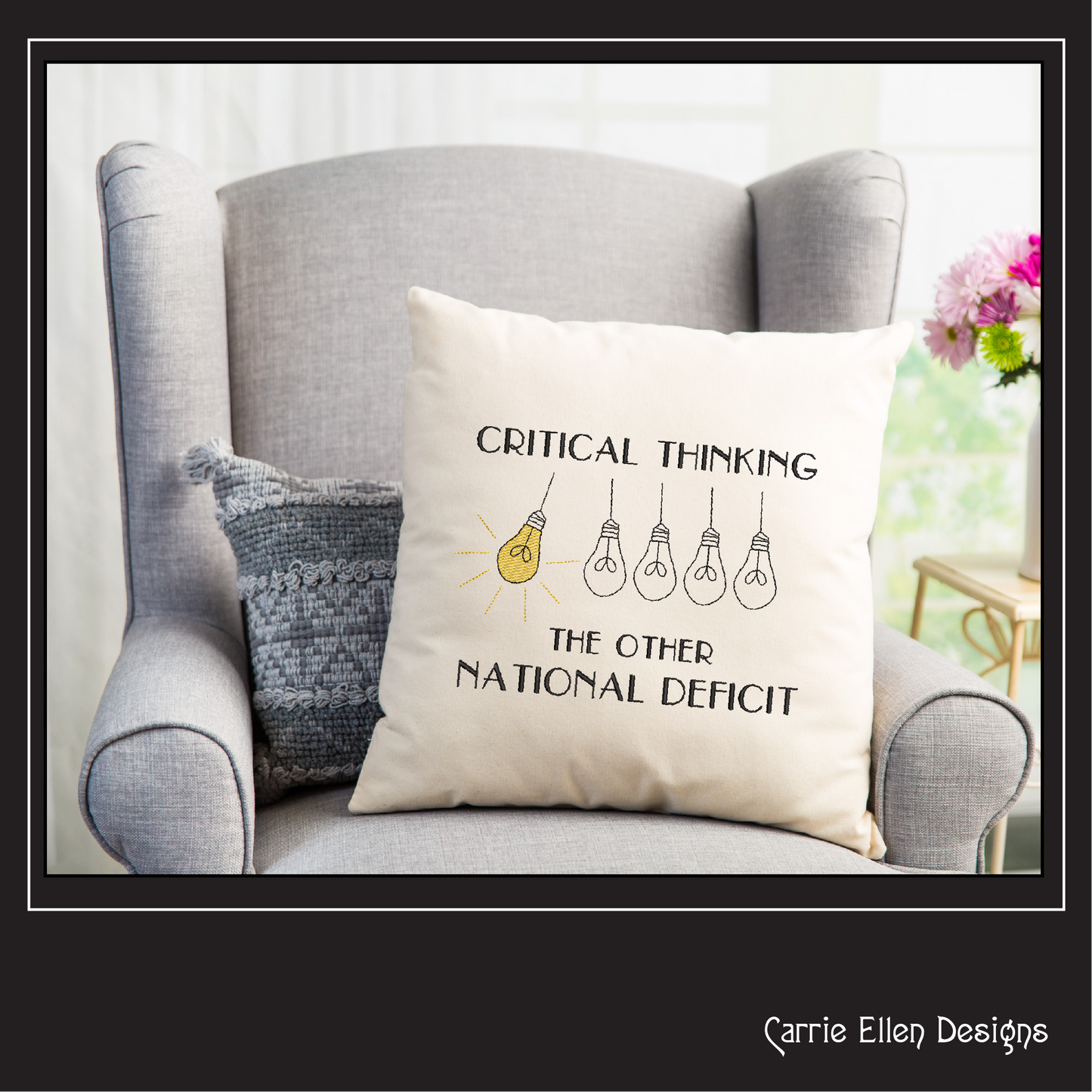 Decorative pillow with 'Critical Thinking: The Other National Deficit' text on a gray armchair.