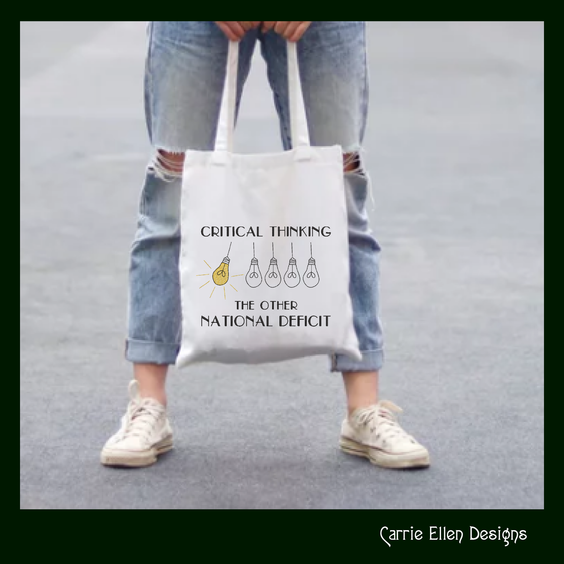 Tote bag with 'Critical Thinking: The Other National Deficit' text and light bulb graphics, held by a person wearing ripped jeans and white sneakers.